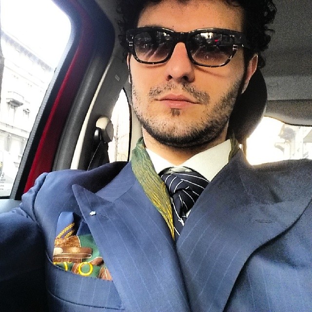 On the road with my pochette @lamartina1980 my glasses @borsalino_world and my tie @saintlaurent_official